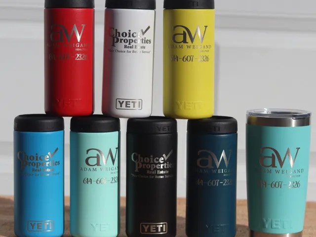 Engraved YETI tumblers in several colors made for a realtor and a real estate agency